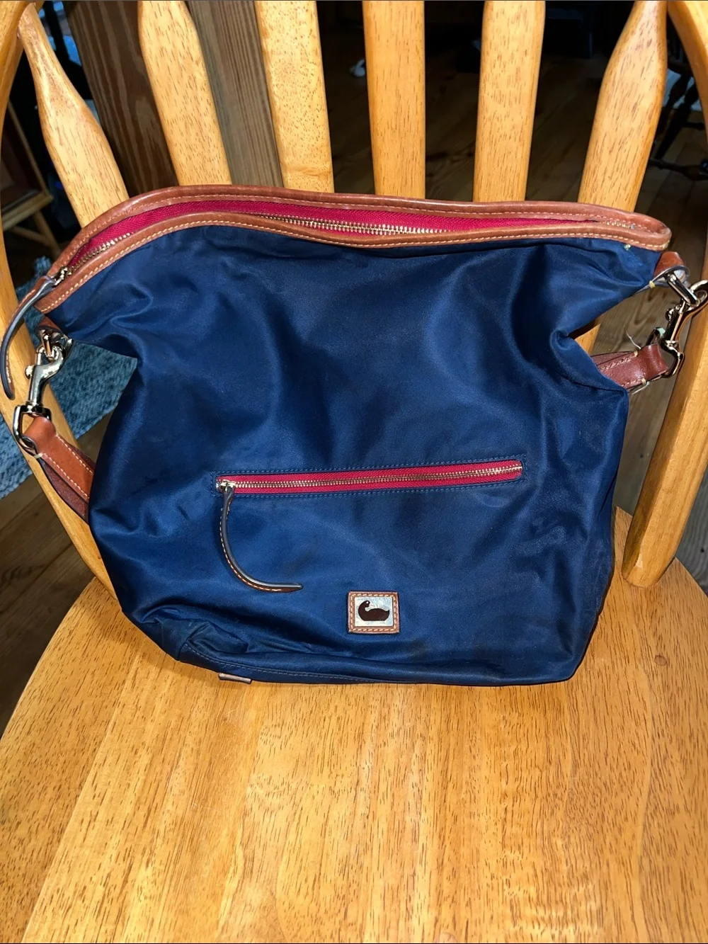 Dooney & Bourke Navy Nylon Messenger Bag with Brown Leather Trim and Red Accents